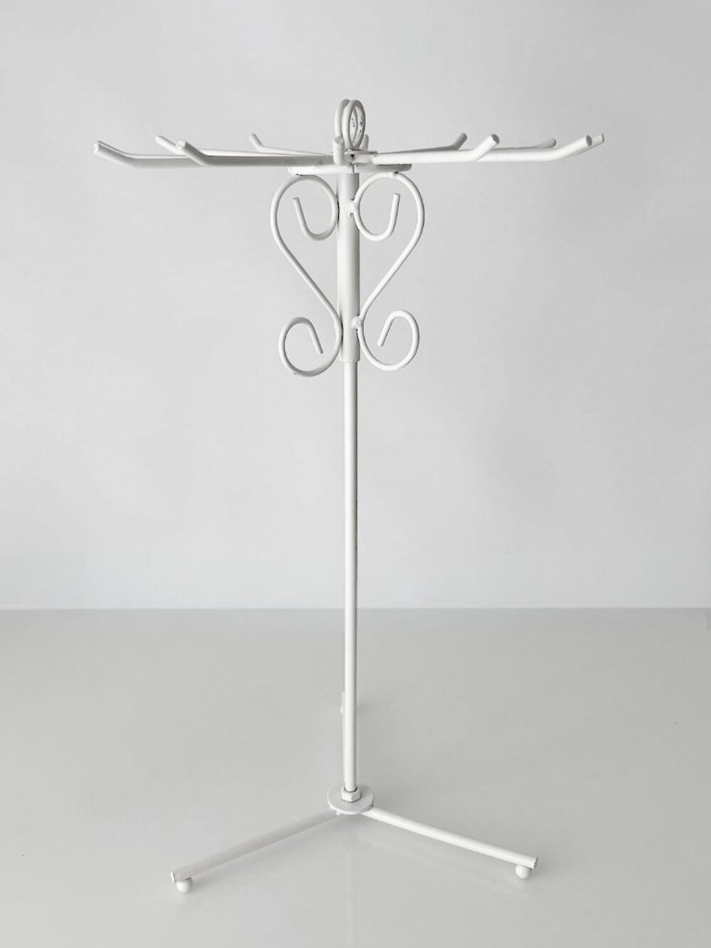 white swivel jewelry stand